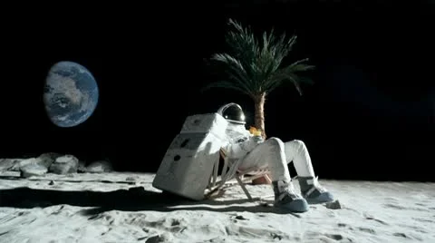 SLO MO, WS, Lockdown of an astronaut on the moon sitting in a reclining beach Stock Footage