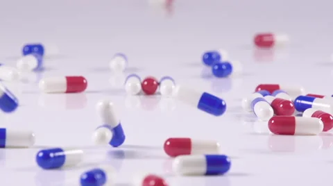 Slo-Motion Bouncing Pills Reversed Stock Footage 45911546