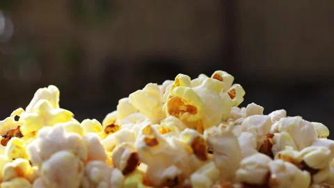 Slo motion closeup video of Popcorn falling, 4K resolution Stock Footage 303324886