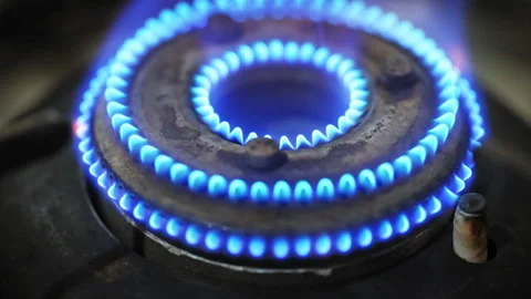 Slo motion Ignition of a blue flame of gas stove, Close-up 4K video Stock-Footage 303398822