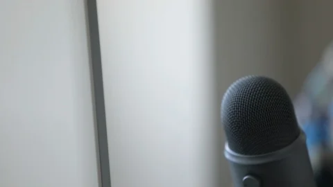 Slo-Motion Pan Shot Of Pro Microphone and PC Monitor On Modern Desk Stock Footage 96127312