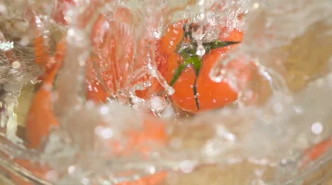 Slo-motion tomatoes falling Stock Footage 59994138