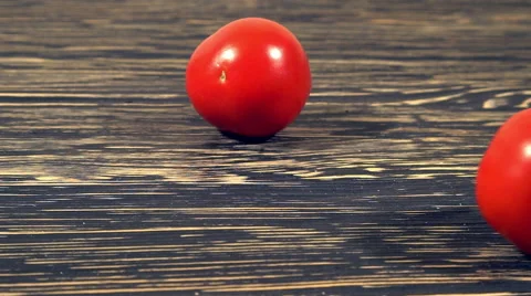 Slo-motion tomatoes rolling Stock Footage 68644193