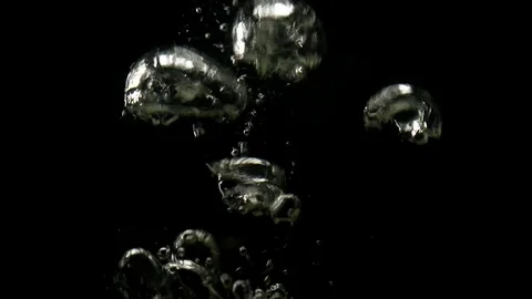 Slo-motion whole lemon and lime falling on water Stock Footage 80608087