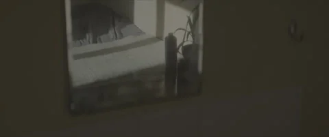SLog shot of a bed reflected in a mirror with soft light Stock Footage 302345614