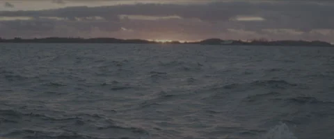 SLog shot of distant islands at sunset Stock Footage 302347854