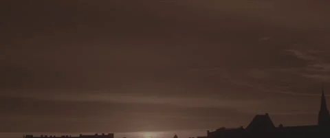 SLog shot of a glowing orange sunset over the city skyline Stock Footage 302355321