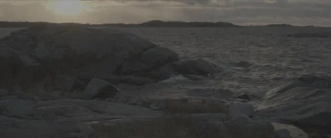 SLog shot of rugged coastal rocks at sunset Stock Footage 302348231