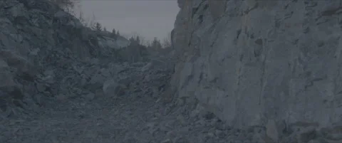 SLog shot of a rugged stone quarry in cold blue light Stock Footage 302354194