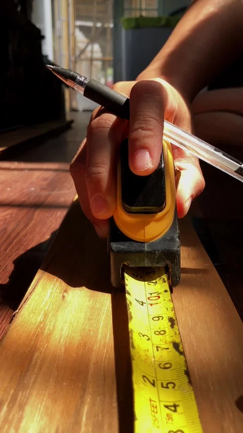 SloMo Camera Push Forward A Hand Of Craftment Measuring Tape Wood Vener Stock Footage 340016331