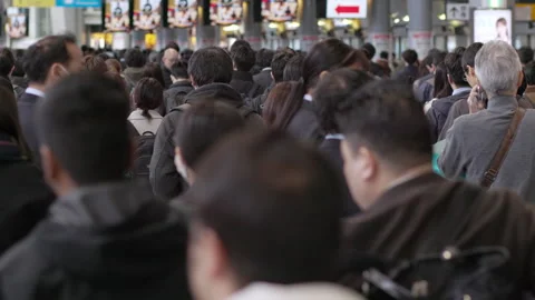 SLOMO Crowds of rush hour commuters in Tokyo from behind (editorial) Stock Footage 295449312