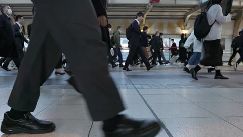 SLOMO Legs of commuters walking through Shinagawa station (editorial) Stock Footage 295447265