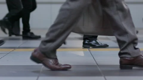 SLOMO Legs of commuters walking through Shinagawa station (editorial) Stock Footage 295447285