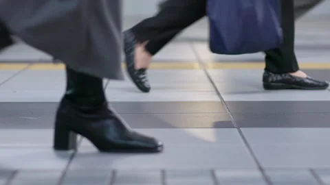 SLOMO Legs of commuters walking through Shinagawa station (editorial) Stock Footage 295447638
