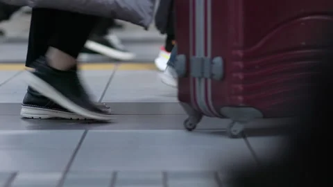 SLOMO Legs of commuters walking through Shinagawa station (editorial) Stock Footage 295448690