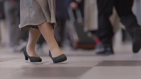 SLOMO Low view of legs walking through Shinagawa Station (editorial) Stock Footage 295744532
