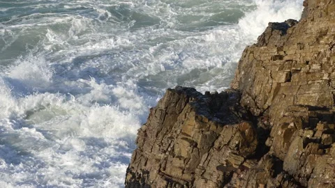 Slomo of Ocean Wave Breaking onto Rocks. Stock Footage 204865419