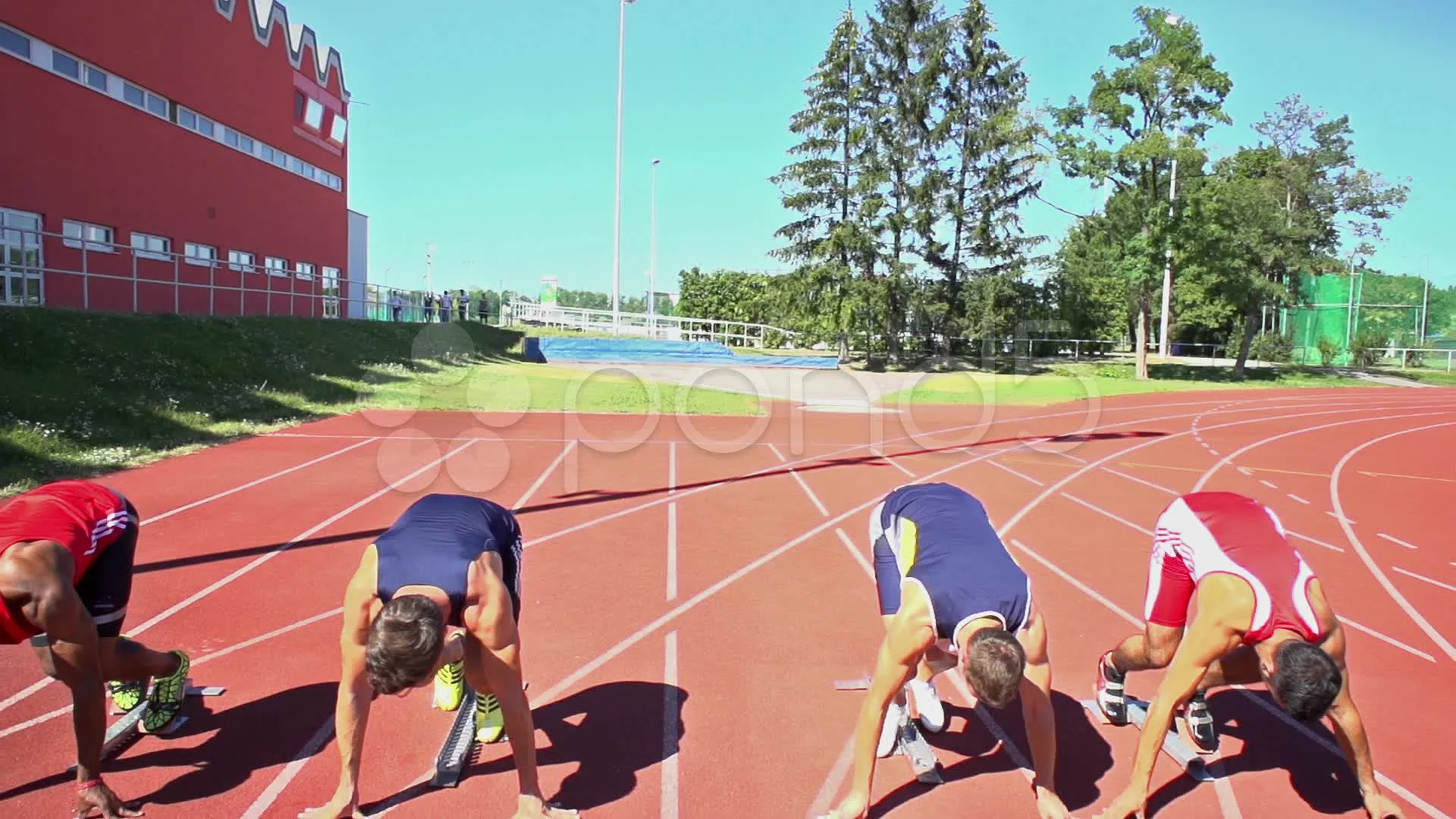 Slow motion of four sprinters on start Stock Video Footage by ©amriphoto  #102756702