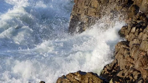 Slomo of Wave Breaking Onto Rocks Stock Footage 204854258