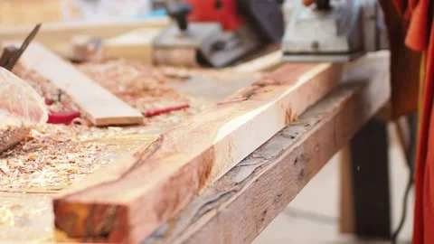 Slomotion of A carpenter is working using an electric planer Stock Footage 139186897