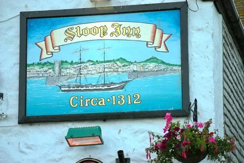  The Sloop Inn pub sign in St Ives, , Cornwall England UK Hanging pub sign... Stock Photos