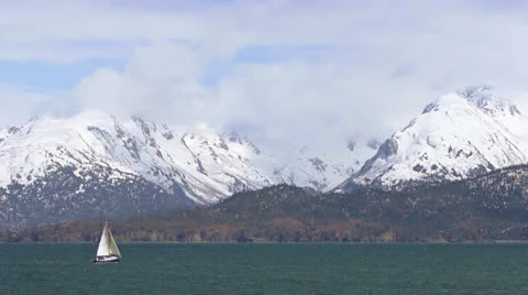Sloop under Sail on Kachemak Bay with Mountains Stock Footage 23254551