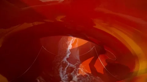 Slope down by water slide in water park. Fun travel inside of the multi color Video stock 68945210