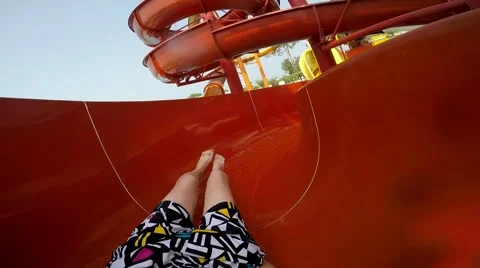 Slope down by water slide in water park. Fun travel inside of the multi color Stock Footage 68945225