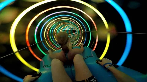 Slope down by water slide in water park. Fun travel inside of the multi color Stock Footage 68945260