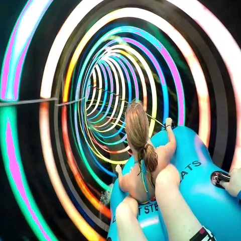 Slope down by water slide in water park. Fun travel inside of the multi color Stock Footage 69532485