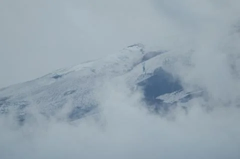 Slope of the Llaima volcano covered by clouds. Stock Photos