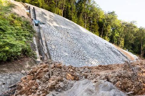 Slope retention construction work being carried out to manage landslide Stock Photos