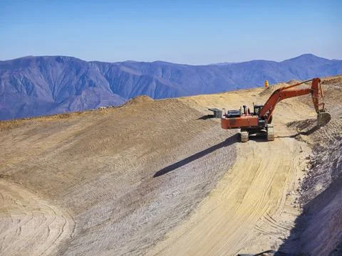 Slope stabilization with heavy machinery, platform profiling Stock Photos