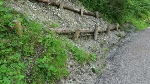 Slope stabilization of a hill side at trail path in alpine mountains. Vídeo Stock 114119999