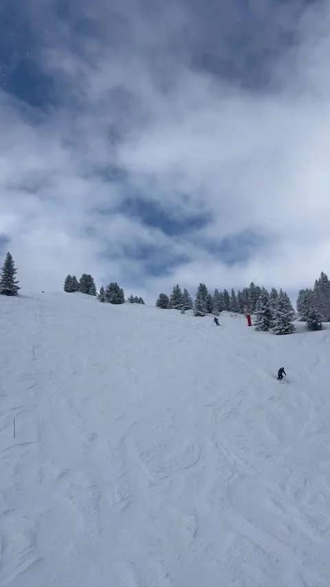 Slopes of Courchevel ski resort by winter with skiing people in French alps Stock Footage 334426359