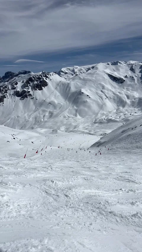 Slopes of Courchevel ski resort by winter with snowcapped mountains Stock Footage 337154475