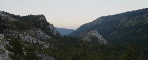 Slopes of mountain ranges covered with forest Stock Footage 92053089