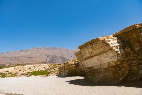Sloping layered limestone rocks in the Mediterranean landscape on Triopetra.. Stock Photos