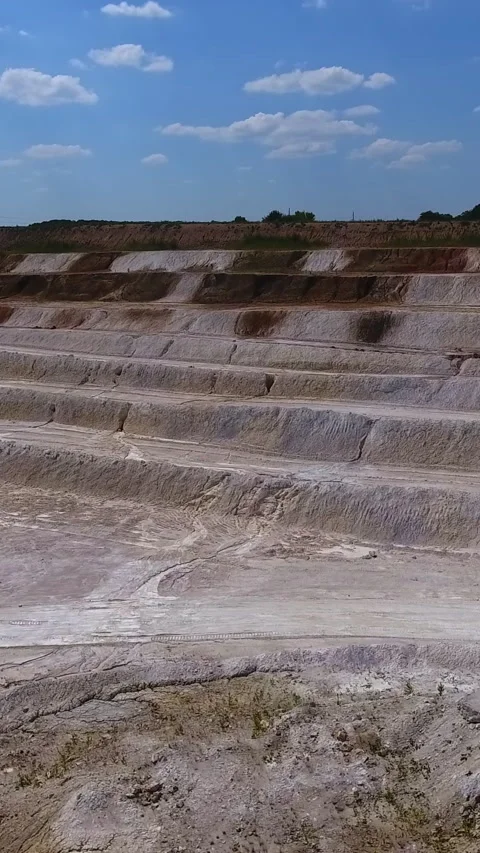 Sloping stairs created on the ground after the process of mining kaolin Stock Footage 270375880