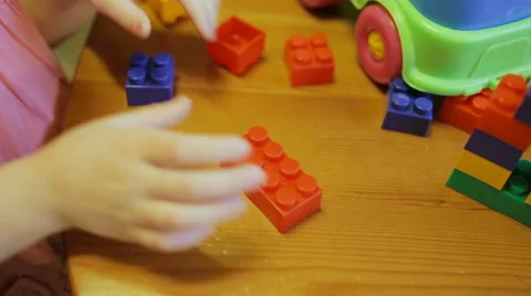 Сlose-up of a child's hand playing in constructor Stock Footage 61380821