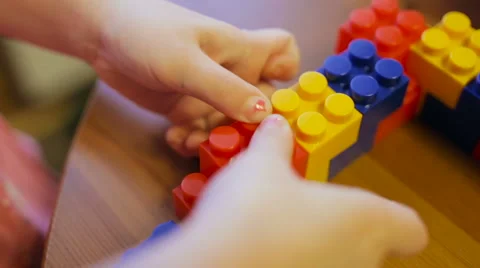 Сlose-up of a child's hand playing in constructor Video stock 61380829
