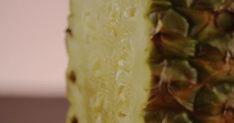 Сlose-up of drop of water flowing down pineapple. 4K Slow Motion Stock Footage 125066891