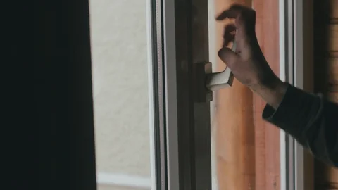 Сlose-up female hand opens a window on airing. Social distancing. Fresh air  Video stock 129096689