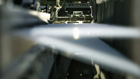 Сlose-up of the process fabric creation on a modern weaving loom in a factory Stock Footage 88469340