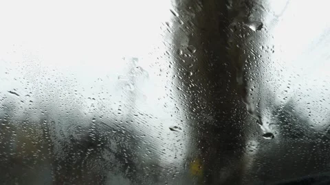 Сlose-up, raindrops flowing down the glass, cloudy. Stock Footage 271235482