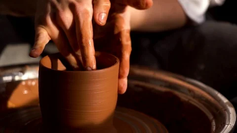 Сlose up shot of woman's hands worked on a pottery wheel Stock Footage 123499570