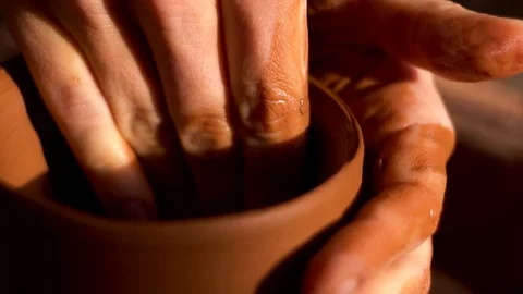 Сlose up shot of woman's hands worked on a pottery wheel Stock Footage 123499588