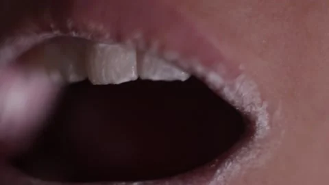 Сlose-up view of person brushing teeth with pink toothbrush and tooth-powder Stock-Footage 152125881