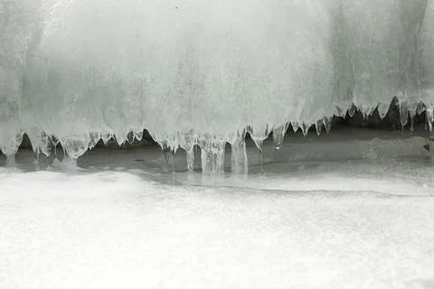Slots of little thin with tiny icicles dripping spring Stock Photos