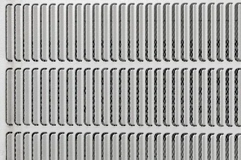 Slotted metal plate pattern as background Stock Photos